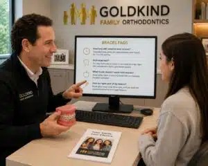 Orthodontist answering braces FAQs during consultation